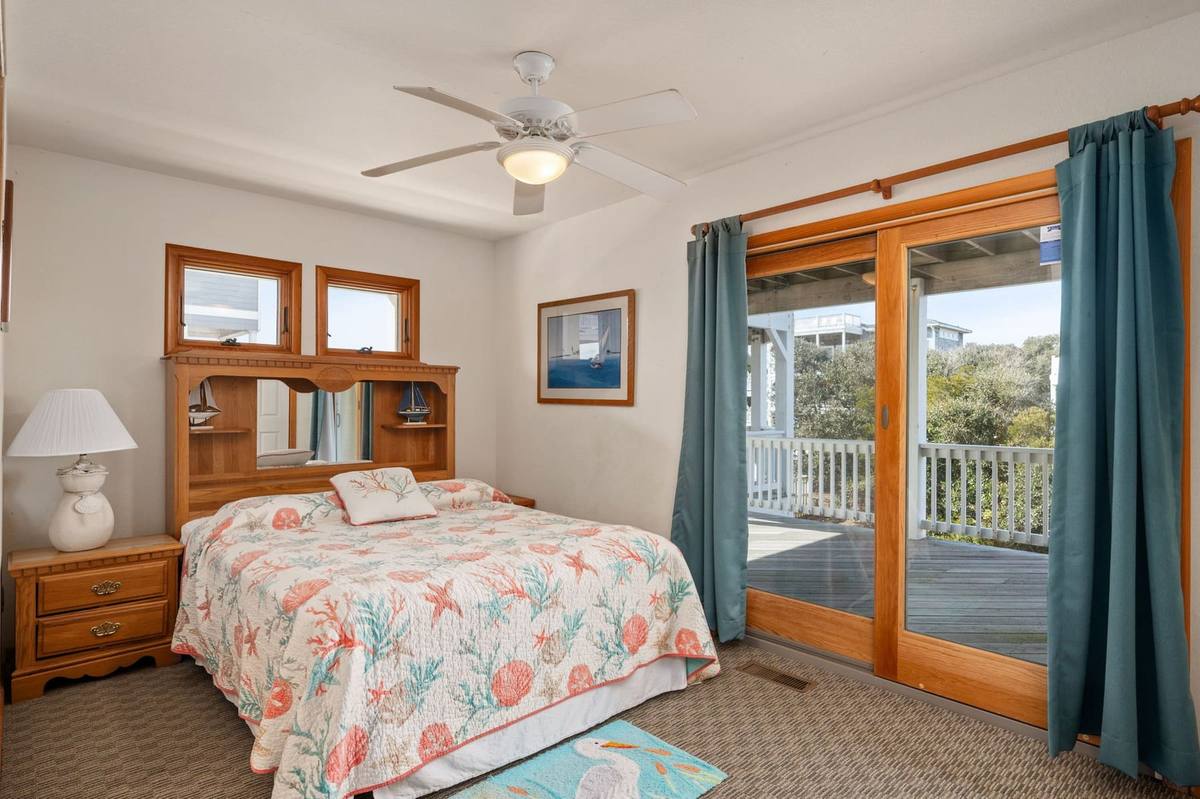 Bedroom 5 on the mid level, with deck access