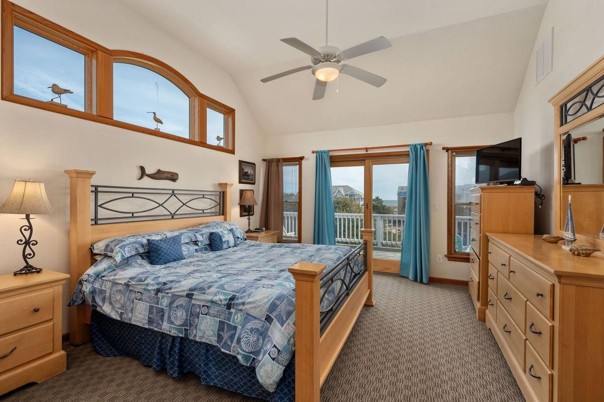 Bedroom 6 on the top level, furnished with a king bed