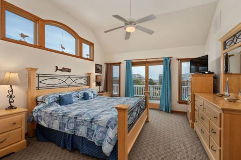Bedroom 6 on the top level, furnished with a king bed