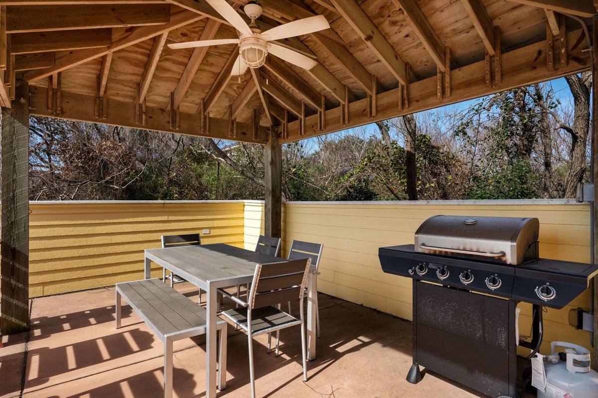 Covered grill and dining gazebo on the pool deck