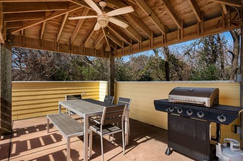Covered grill and dining gazebo on the pool deck
