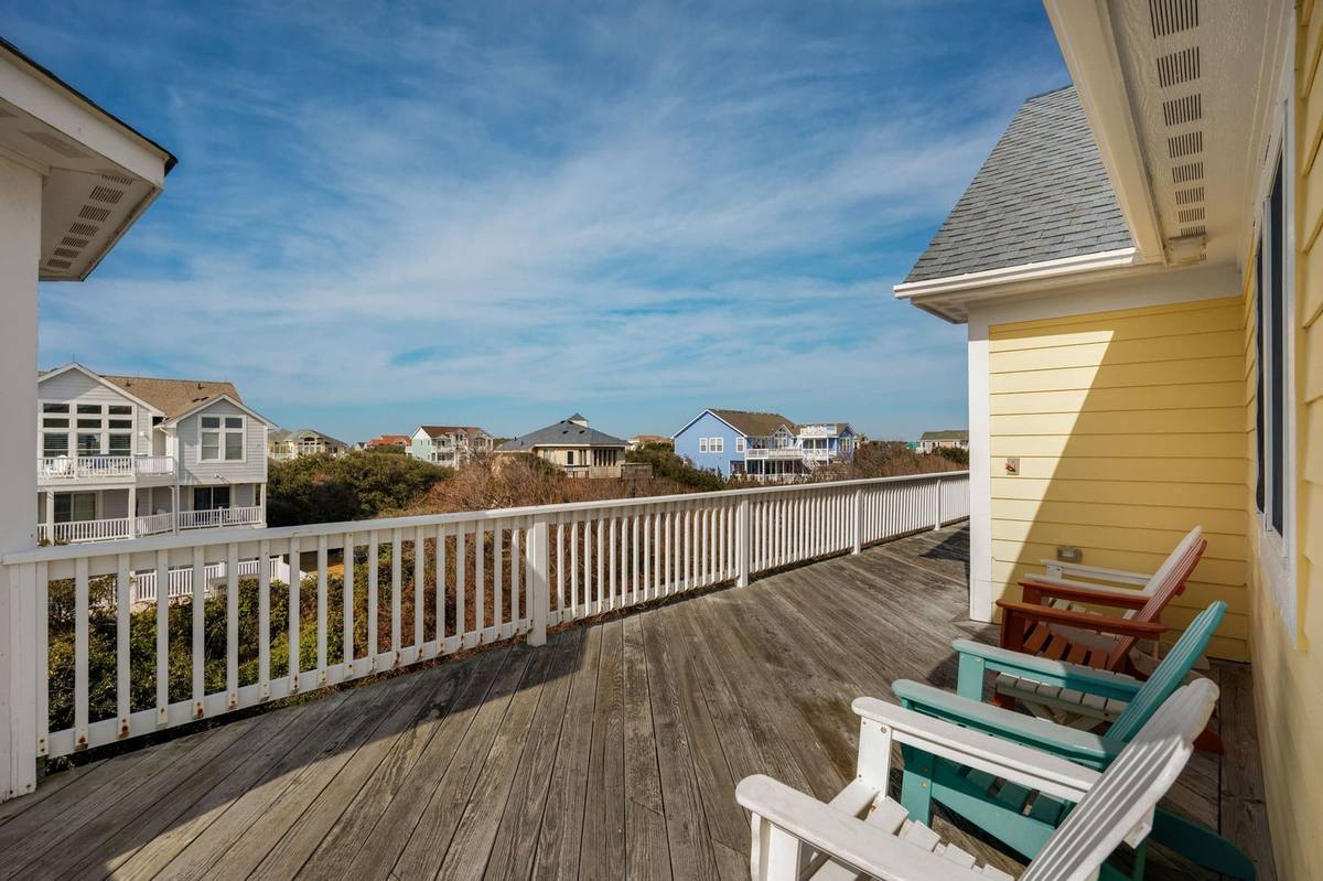 Rear deck off the top level furnished with lounge seating