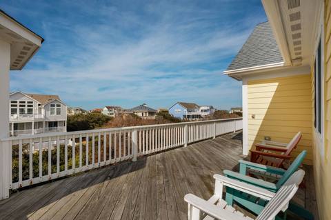 Rear deck off the top level furnished with lounge seating