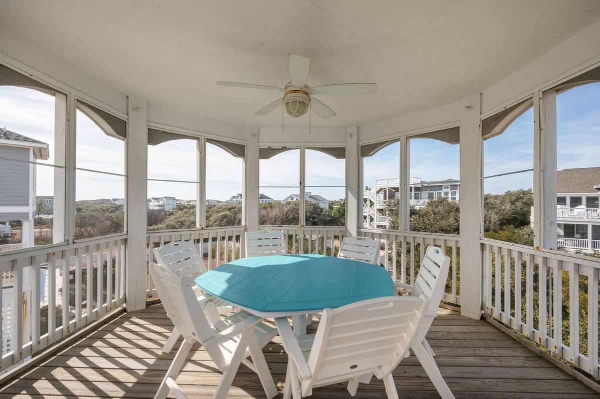 Screened gazebo porch off the top level, furnished for sitting outdoors bug-free