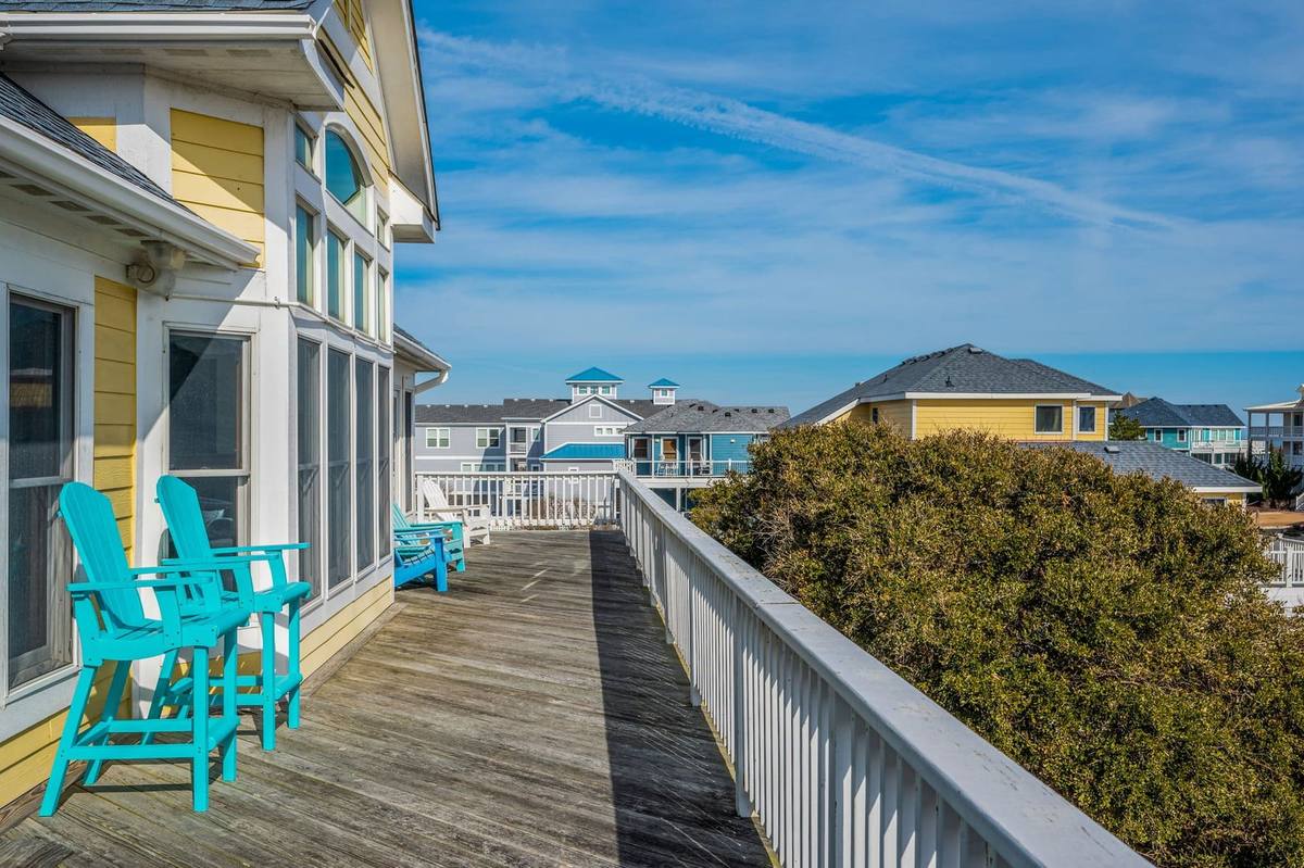Covered wraparound deck off the top level with outdoor seating