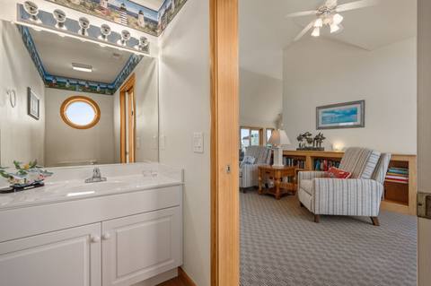 Top-level half bathroom with lighthouse-themed decor